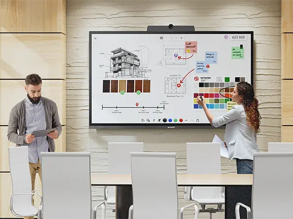 2 people looking at design options on a PN-LA display