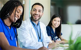 Doctor and assistants working at a desk area