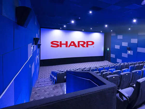 Movie theater with Sharp logo on the screen