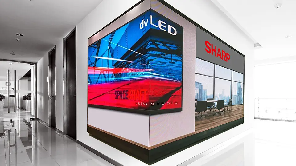 A dvLED display on the corner of a wall outside a conference room