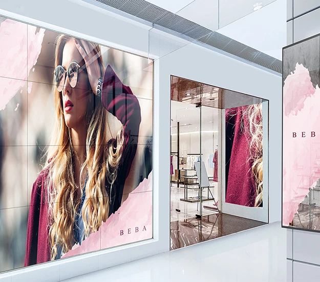 A modern direct view led display featuring fashion advertisements, including images of stylish women wearing sunglasses and fashionable outfits within a retail space.