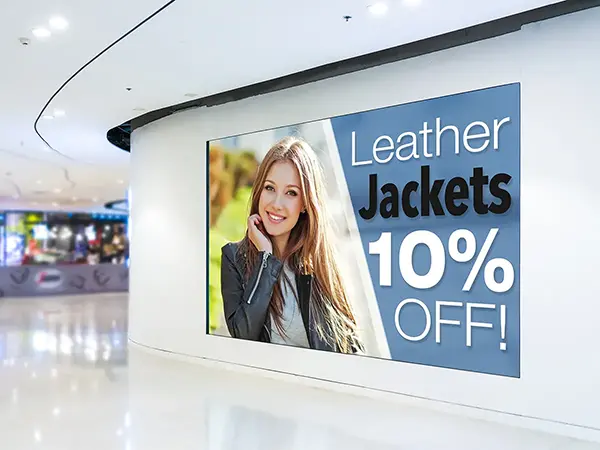 Leather jacket sale advertisement on a display in a mall