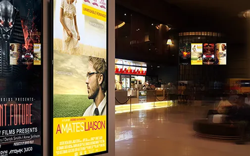 Displays with movie posters in a movie theatre lobby