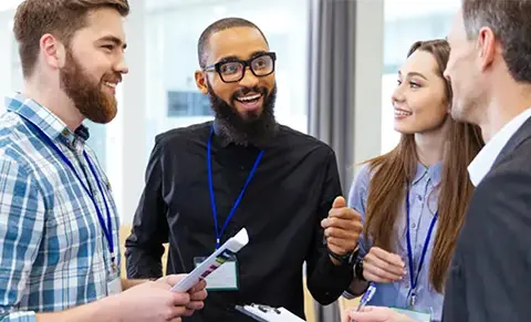 A group of office workers discussing partnership