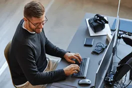 Overhead view of a man working on a computer