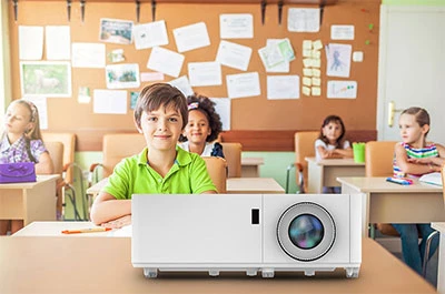 Classroom of students at their desks with a projector in the front
